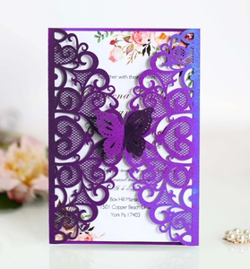 Intricate laser-cut purple lace wedding invitation with 3D butterfly and floral inner card