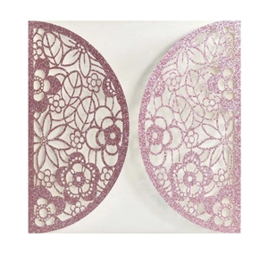 Detail view of pink glitter hollow-out floral lace invitation card with laser-cut design