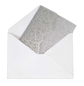 Detail of silver glitter paisley embossed card with premium white envelope for invitations