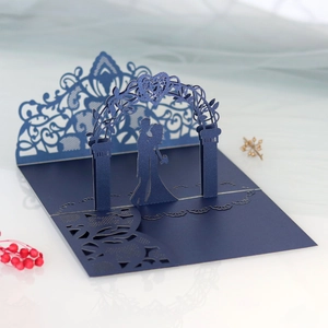 Detailed laser-cut dark blue 3D pop-up wedding invitation card with romantic couple