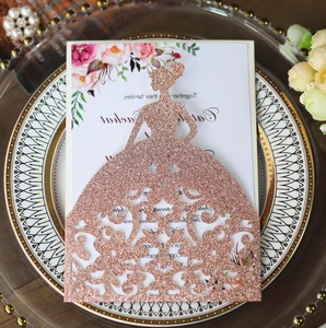 Detail of rose gold glitter laser-cut bride dress invitation for elegant weddings