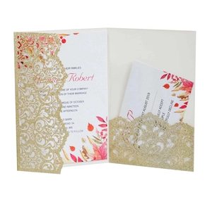 Detailed laser-cut gold glitter lace wedding invitation with autumn leaf inside card
