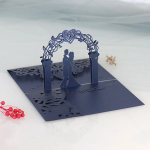Detailed laser-cut 3D pop-up wedding invitation card in navy blue with heart arch design