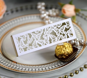 Detail of laser-cut butterfly gift box with gold liner for wedding sweets and favors