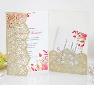 Detailed laser-cut gold glitter wedding invitation set with floral inner card and RSVP