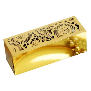 Detailed laser-cut gold wedding favor box featuring intricate floral patterns and glossy finish