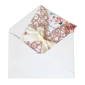 Rose gold glitter laser cut floral wedding invitation with pink flower inner card and ribbon