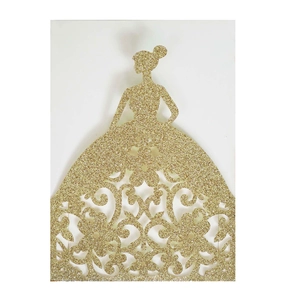 Macro view of gold glitter laser cut wedding invitation with elegant girl silhouette