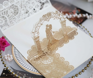 Detailed 3D pop-up wedding card with laser-cut lace and golden glitter floral archway