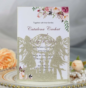 Detail of laser-cut gold glitter wedding invitation with angel and castle design