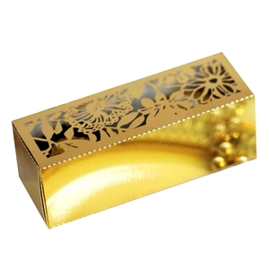 Detailed top view of gold laser-cut hollow rose pattern on an elegant wedding candy box