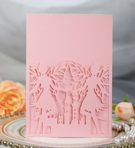 Detail showing pink laser-cut castle and fairy design on pearlescent party invitation
