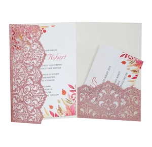 Detailed laser-cut glitter pink wedding invitation with floral insert and RSVP card