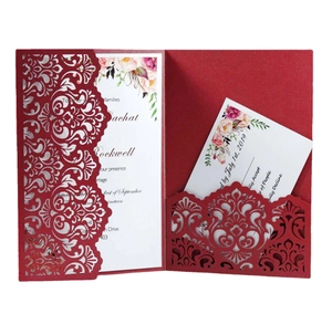 Elegant red laser-cut wedding invitation card with intricate European vine patterns