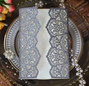 Detail of lavender glitter laser-cut wedding invitation with baroque floral patterns