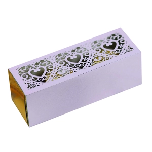 Close-up of laser cut lavender heart gift box with intricate hollow floral patterns