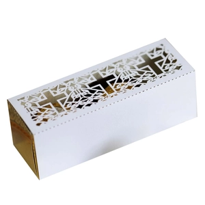 Detailed laser-cut white wedding favor box with cross and floral pattern for baptism