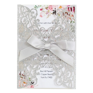 Elegant laser cut glitter silver wedding invitation with grey ribbon and floral inner card