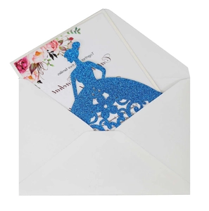 Close-up of laser-cut navy glitter invitation card with floral insert and white envelope