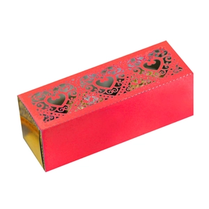Macro detail of red laser-cut heart hollow design on wedding favor candy gift box