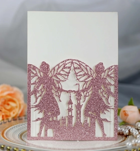 Close-up of glitter castle and fairy laser-cut invitation card with pink shimmer finish