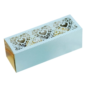 Detail of laser-cut heart pattern on light blue and gold wedding favor gift box