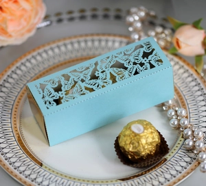 Detailed laser-cut hollow butterfly design on a light blue wedding favor gift box