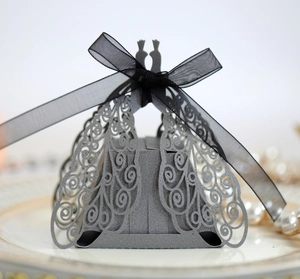 Detailed laser-cut silver pearl paper gift box with elegant ribbon and swan motif