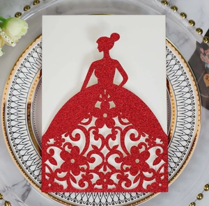 Detailed laser-cut wedding invitation in red glitter with elegant dress silhouette