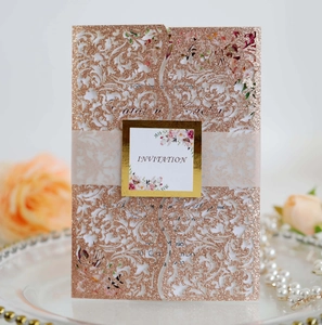 Detailed laser cut rose gold glitter wedding invitation with floral insert card and belly band