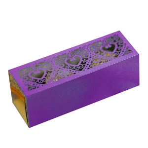 Detail of purple laser-cut heart pattern gift box with golden foil interior