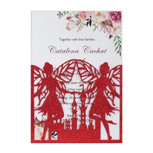 Intricate laser-cut red glitter wedding invitation featuring fairy and castle details