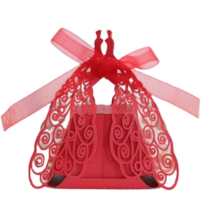 Laser cut red wedding candy box with peacock patterns and an elegant silk ribbon bow