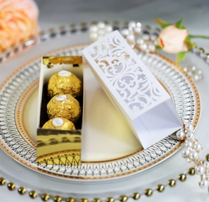 Hollow-out floral wedding candy box with gold inner tray and white lace cutout pattern