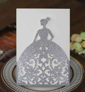 Detailed laser-cut silver glitter wedding invitation with elegant dress silhouette