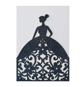 Close-up of laser-cut wedding card featuring a dark blue glitter silhouette of a woman