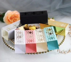 Laser-cut hollow wedding candy boxes with cross design in various colors for party favors