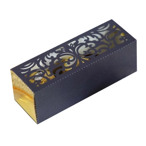 Dark blue laser-cut gift box with hollow floral patterns and gold foil chocolate accents