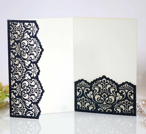 Detailed laser-cut floral lace wedding invitation sleeve in navy blue glitter paper
