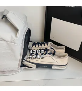 Close-up of a cream sports travel bag with a separate shoe compartment for sneakers