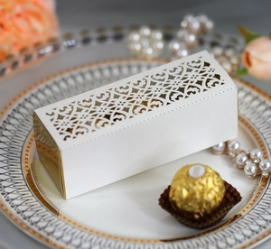 Detailed macro view of laser-cut gift box with floral pattern on vintage porcelain plate