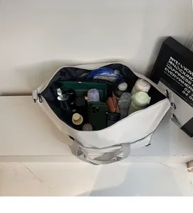 Close-up showing a large travel bag interior with multiple items for storage capacity