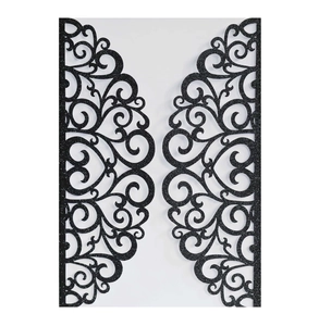 Macro view of black glitter laser cut wedding invitation cover with filigree heart design