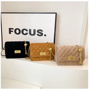 Detailed trio of quilted chain bags in black brown and beige with golden lock and metal balls