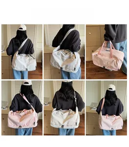 Close-up of a versatile large travel bag in light pink and white with adjustable straps