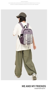 Detailed back view of a purple waterproof backpack with double-layer design and mesh pocket