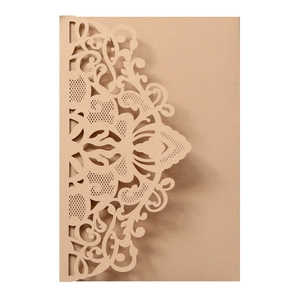 Detailed laser-cut floral pattern on elegant pearlescent paper wedding invitation card