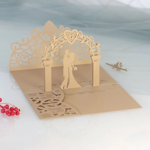 Detailed laser-cut 3D wedding card featuring a couple silhouette under a heart arch