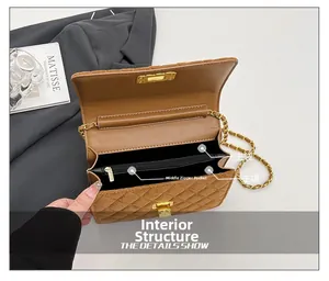 Detail view of the brown quilted bag interior showing dual compartments and zip pocket