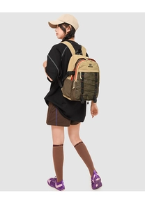 Detail showing the waterproof nylon fabric and green mesh pocket of the outdoor backpack